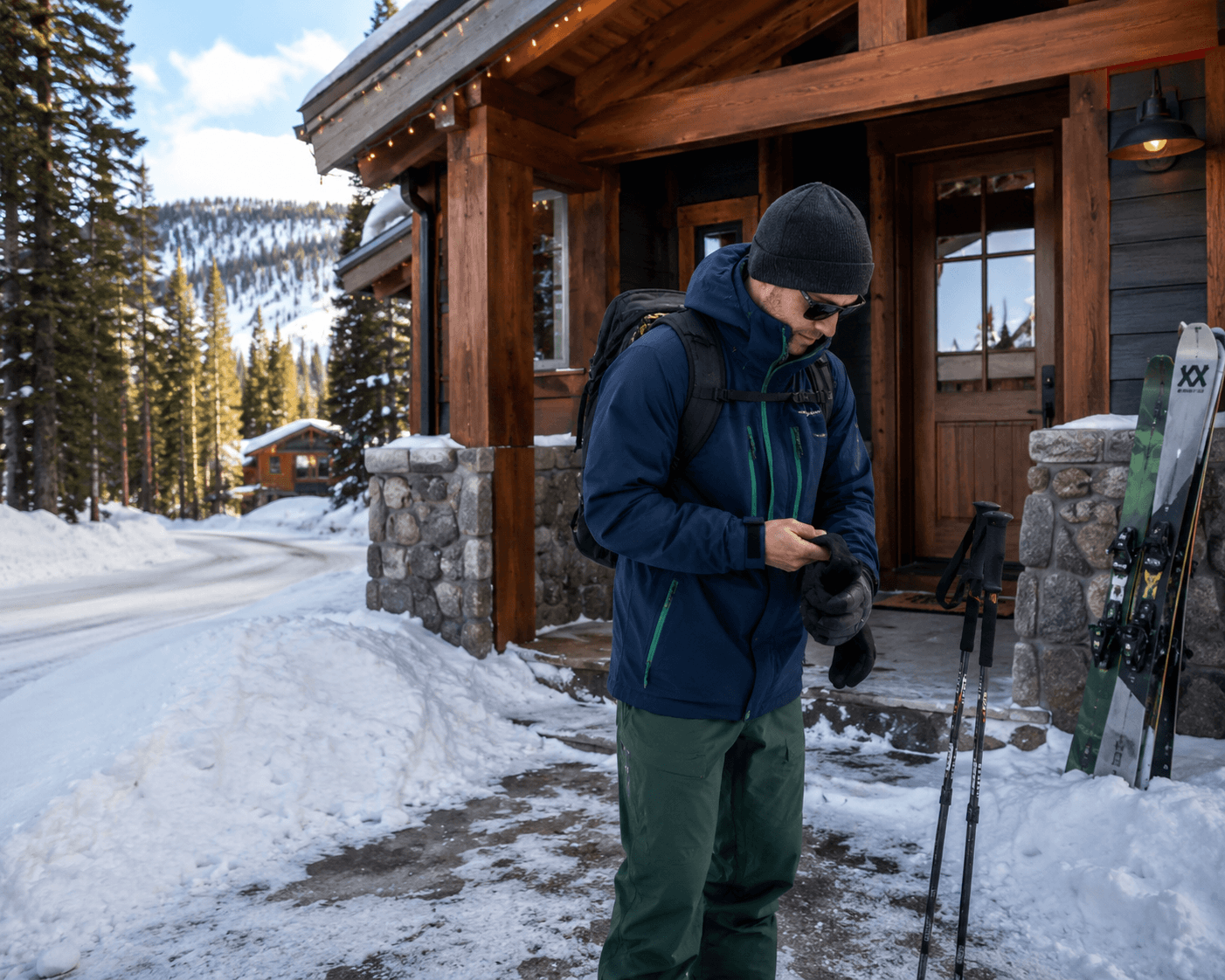 Guest preparing ski gear outside a North Lake Tahoe vacation rental in winter